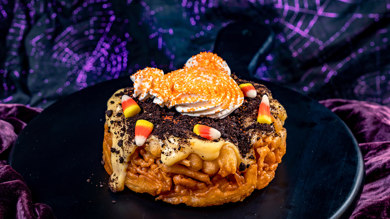 Scary delicious Seasonal Sips & Bites Await Indulge in a variety of delicious, themed treats at dining spots across the Disneyland Resort. From new creations to returning favorites, there's something to satisfy every palate. Details on Disney Eats' full fall lineup will be unveiled closer to the season, but here's a sneak peek of what's in store. Returning for 2024, delight in the Halloween funnel cake at Stage Door Café in Disneyland park, and savor the al pastor tacos inspired by "Coco" at Paradise Garden Grill in Disney California Adventure park!